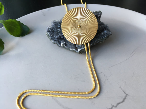 Gold bolo tie necklace medallion