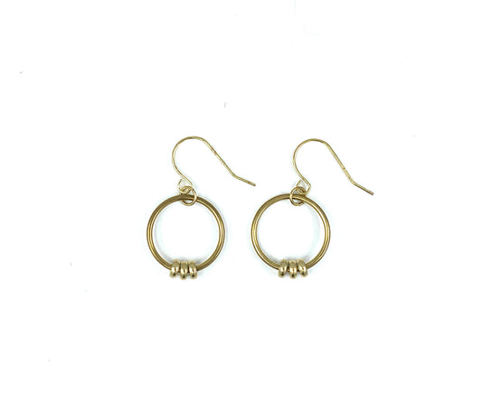 Brass bead hoop earrings on a white background