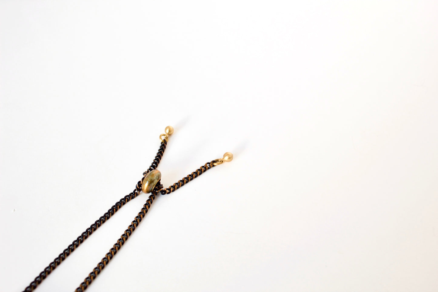 Chain tips and rubber slide bead of bracelet