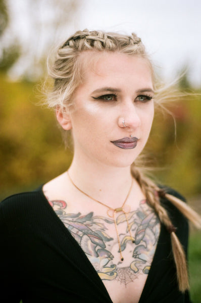 Bow choker necklace on model