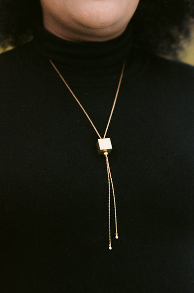 Adjustable gold bolo tie necklace with square pendant