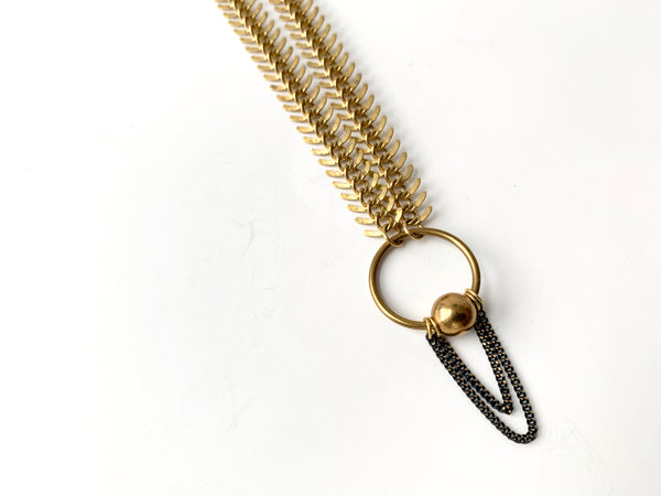 Choker with captive ring and hanging chain