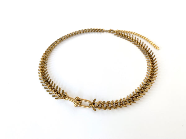 Side view of choker with textured fishbone chain and hardware link pendant