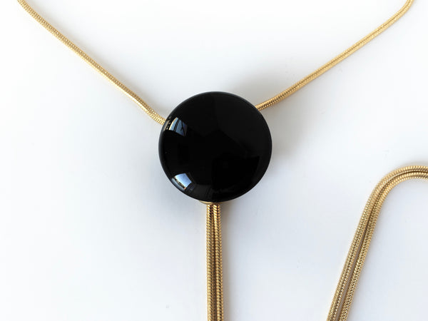Close up of black onyx bolo tie pendant