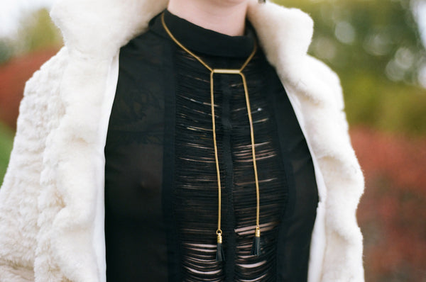 Close-up of tube necklace on a model