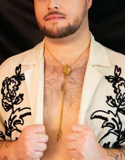 Close-up of model wearing diamond bolo tie 
