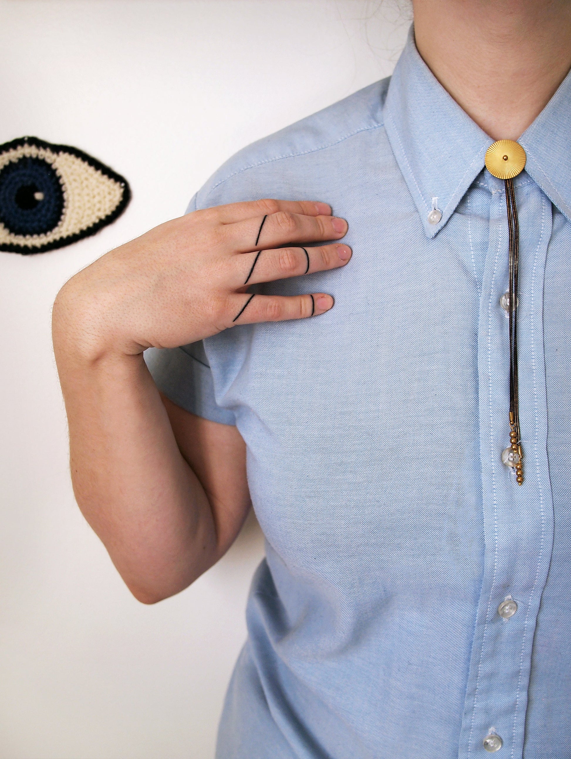 Bolo tie necklace on model