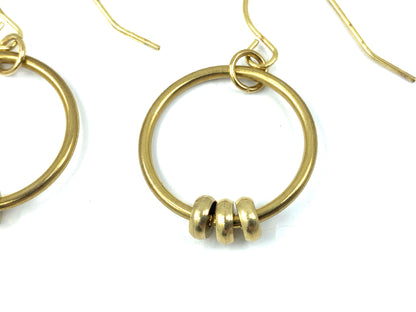 Close-up of handmade bead hoop earrings on a white background