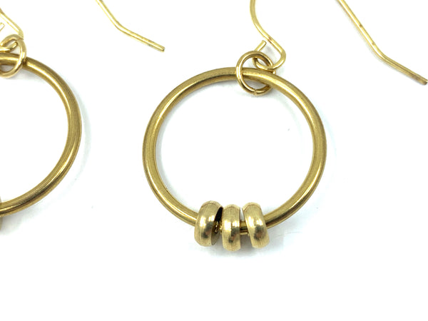 Close-up of handmade bead hoop earrings on a white background