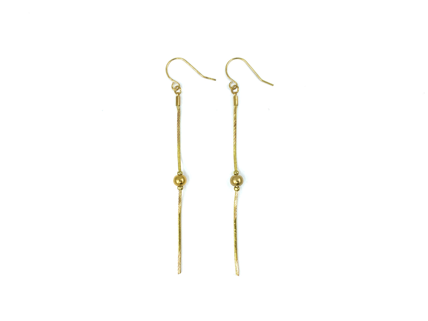 Gold snake chain drop earrings on a white background