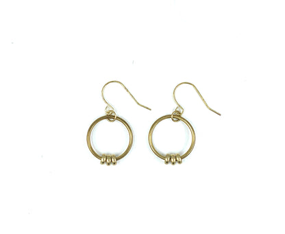 Brass bead hoop earrings on a white background