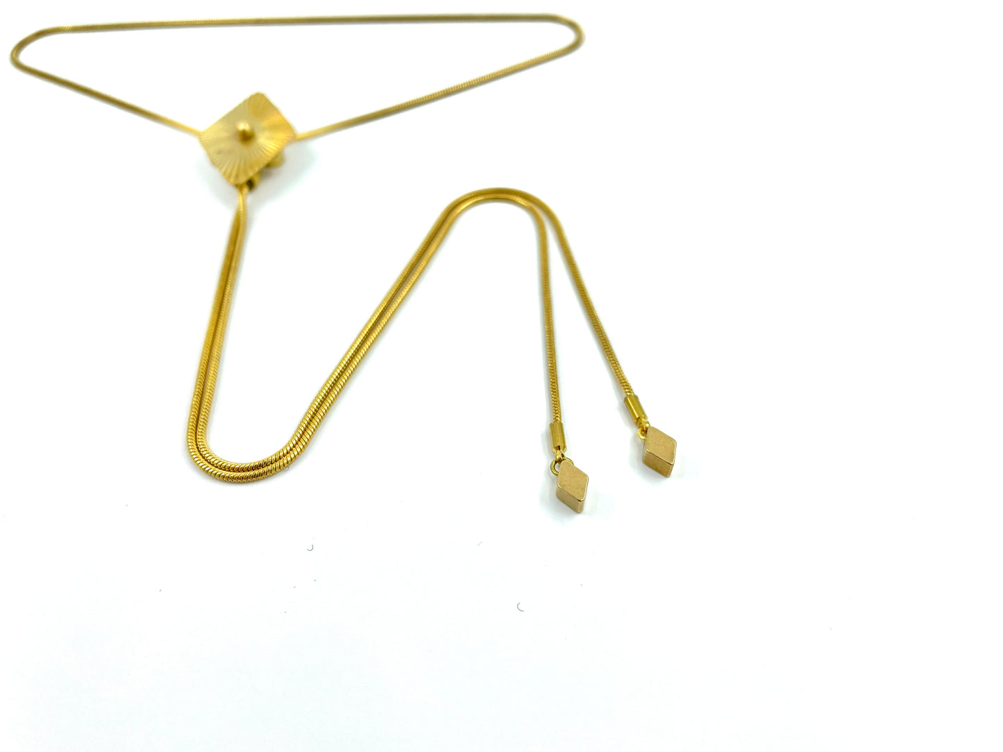 Close-up of diamond bolo tips on a white background