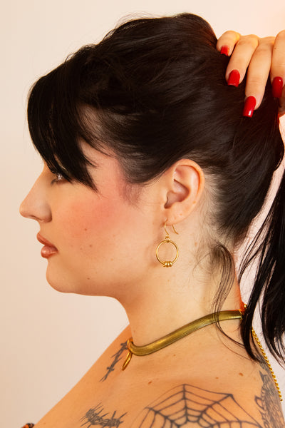 Side view of model wearing fern snake chain choker necklace