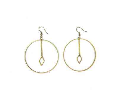 Big hoop earrings with diamond charm on a white background