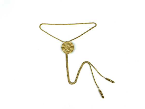 Gold circle bolo tie on a white background