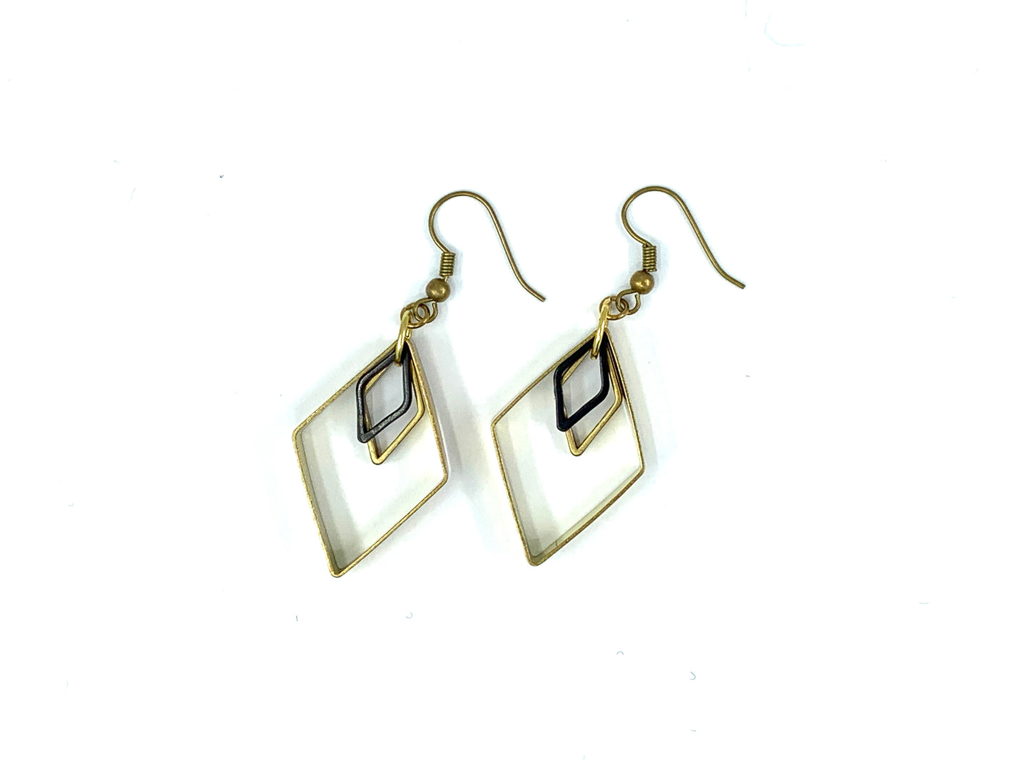 Black and gold triangle charm earrings on a white background