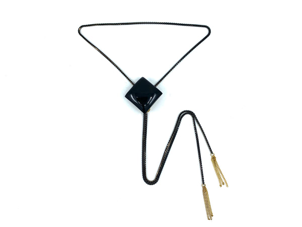 Onyx bolo tie necklace on a white background
