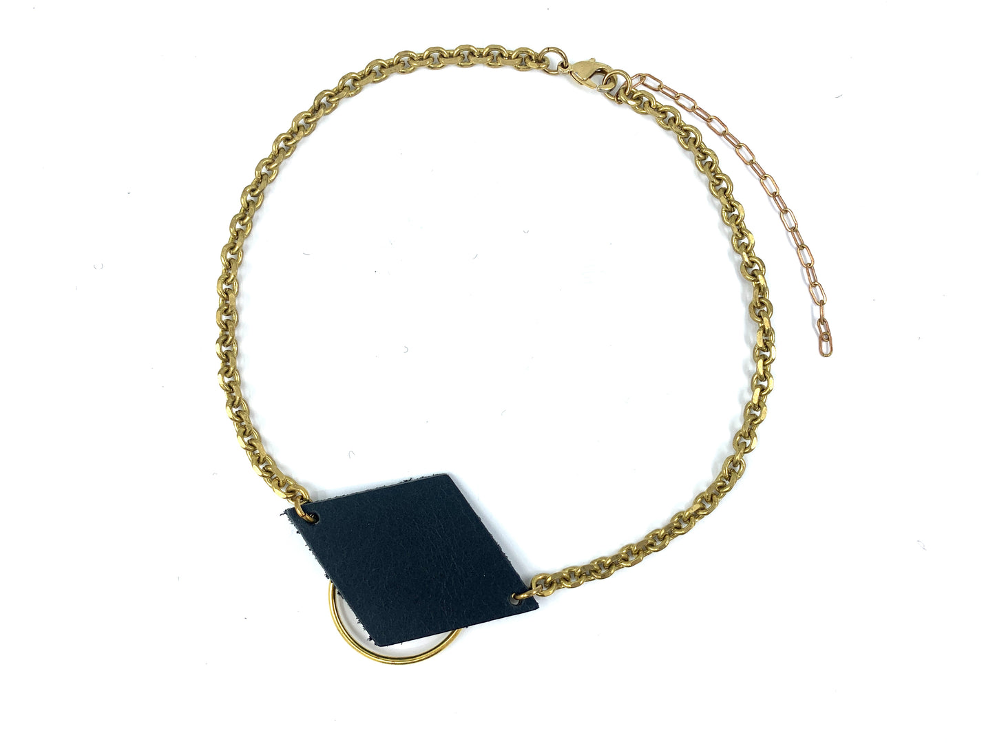 Recycled leather choker necklace with an o-ring and  a thick faceted cable chain on a white background