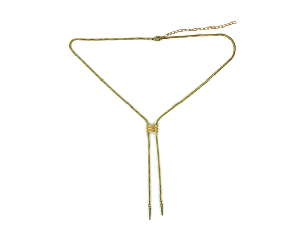 Gold choker necklace with foxtail snake chain, ribbed cinch slide bead and spike tips on a white background