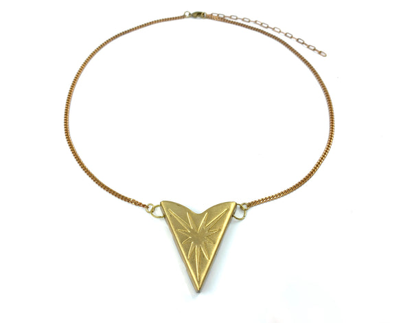Gold star pendant choker on a white background