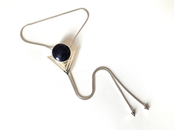 Blue goldstone and sterling silver bolo tie on a white background
