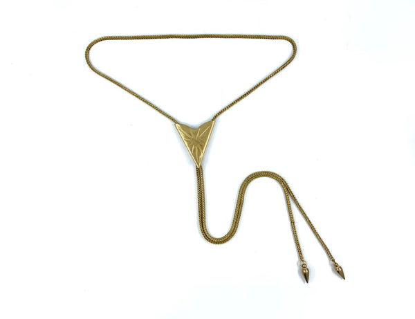 Sunburst bolo tie with a square snake chain and bullet bolo tie tips on a white background