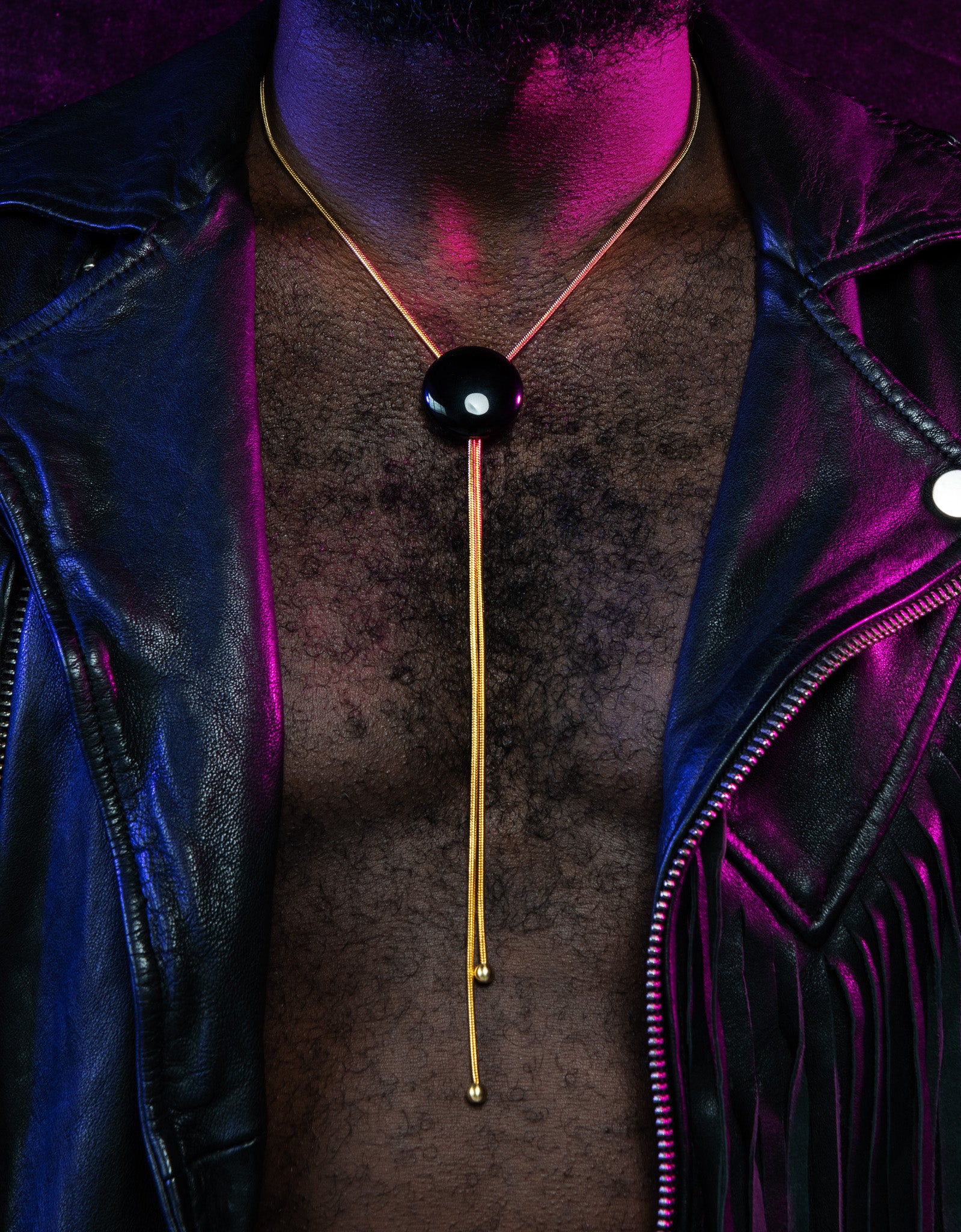 Close up of model wearing onyx bolo tie