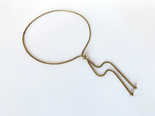 Rolo chain bolo tie with slide bead and round gold bolo tips