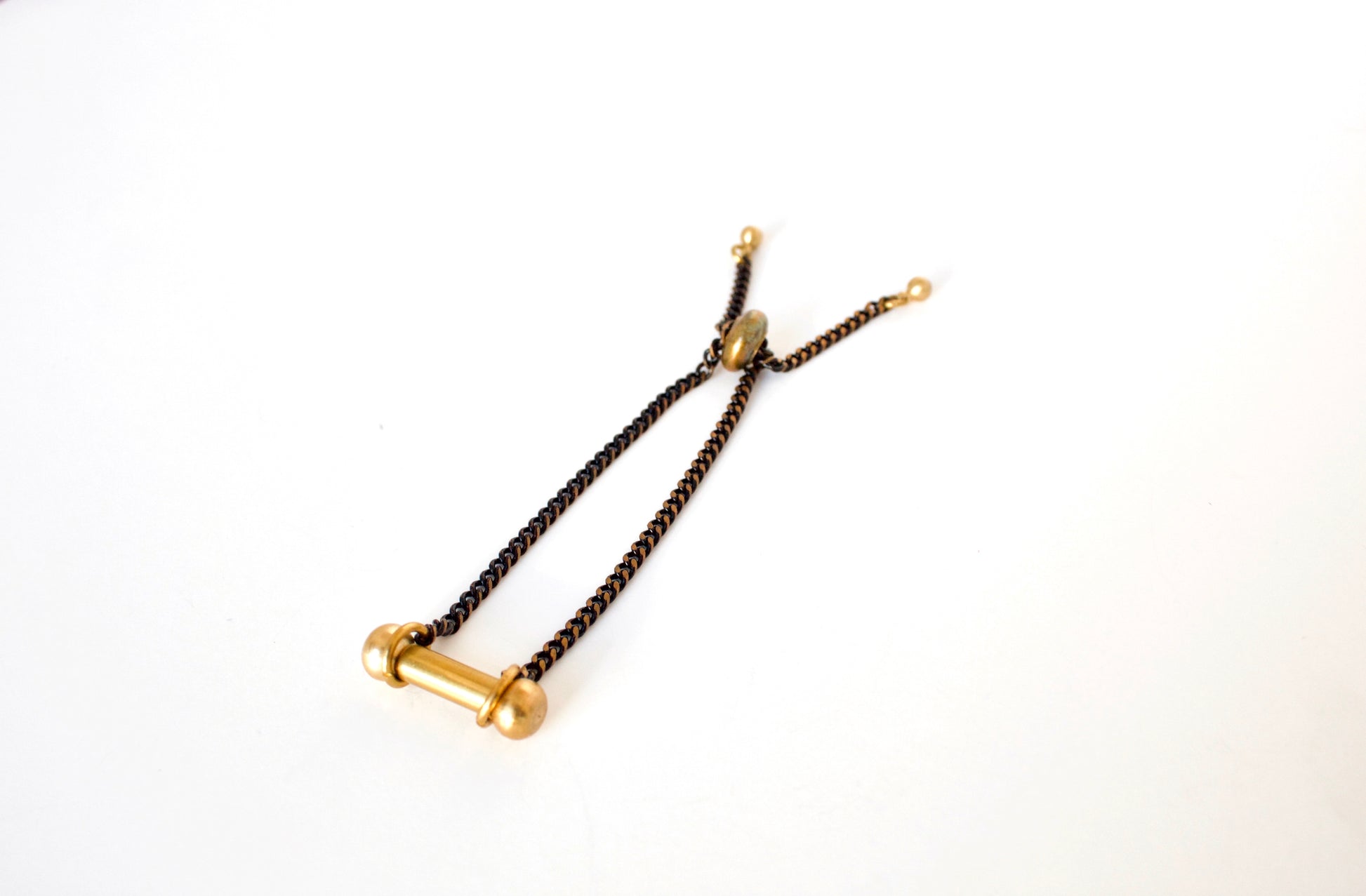 Adjustable black and gold bracelet