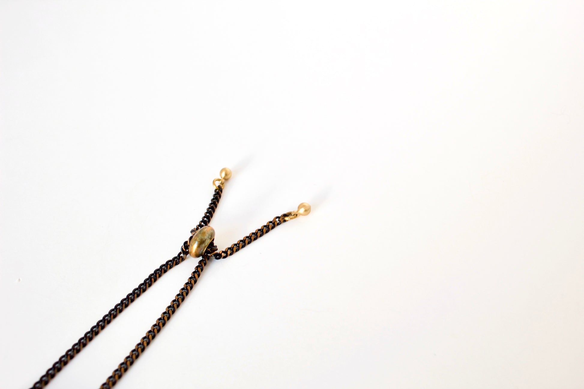 Chain tips and rubber slide bead of bracelet