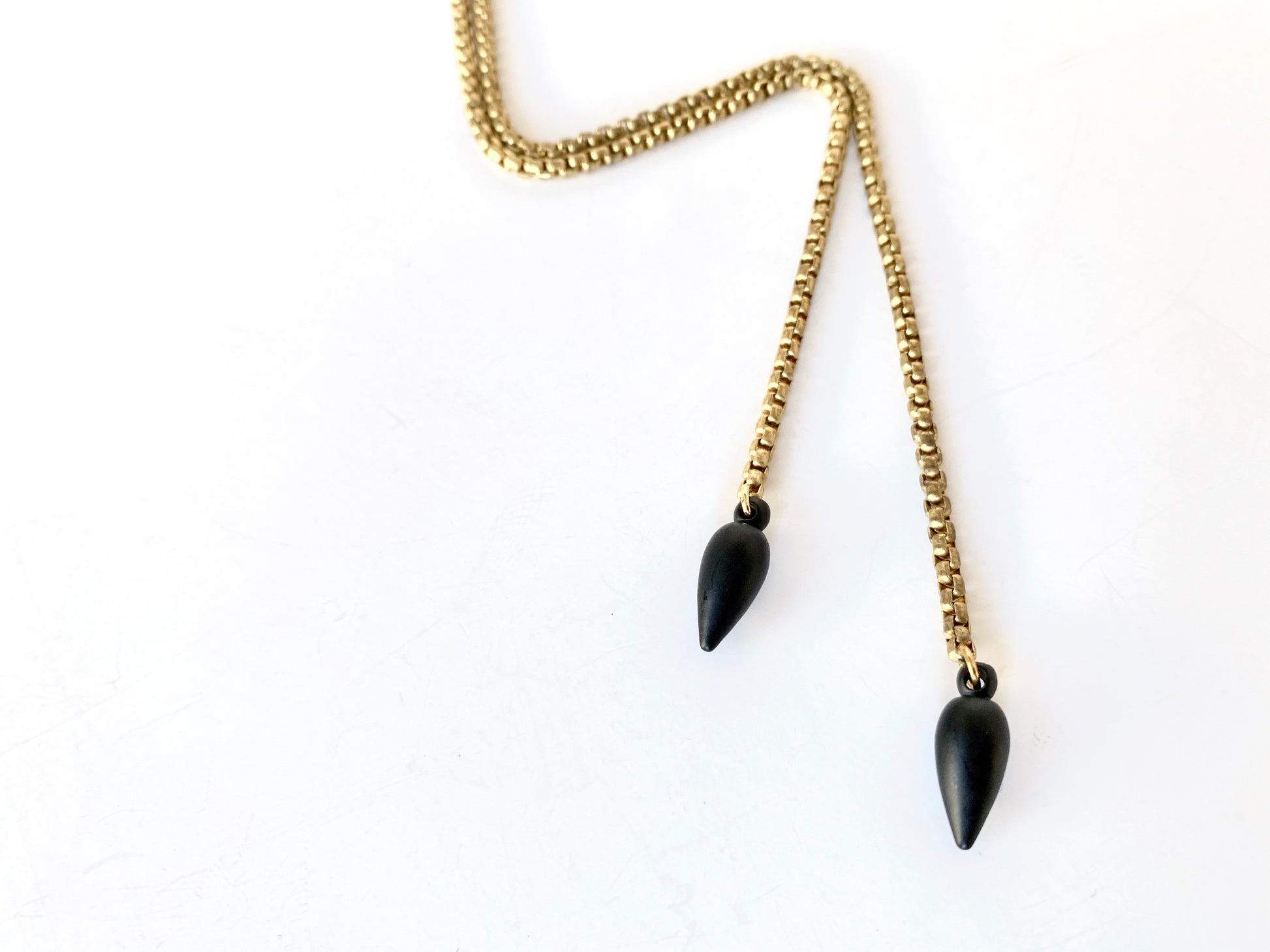 Black pendulum bolo tie tips