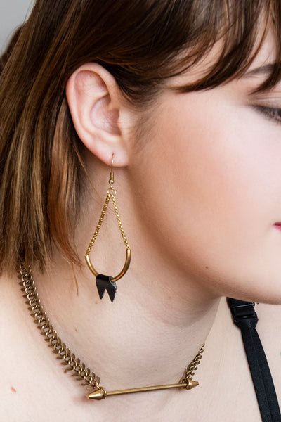 Gold spike choker necklace on a model