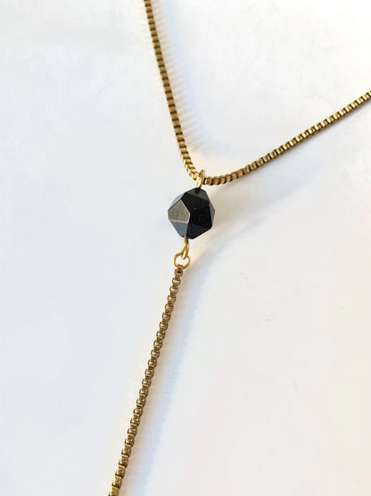 Blue goldstone pendant of gold lariat necklace