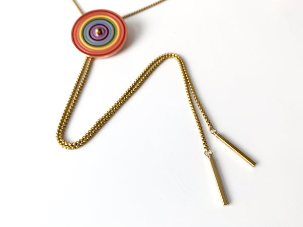 Bolo tie tips of rainbow bolo tie on a white background