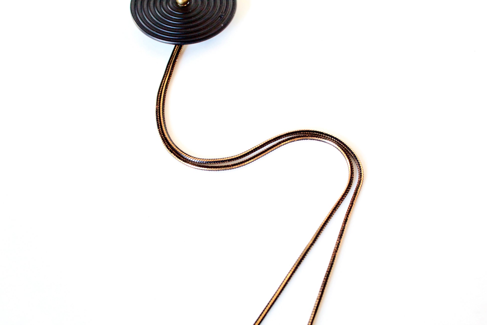 Black and gold snake chain of bolo tie necklace
