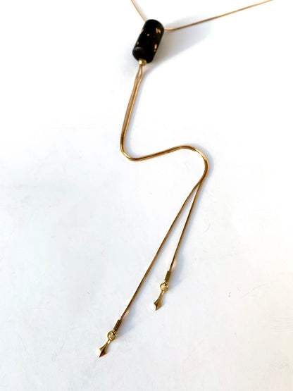 Brass tips of necklace