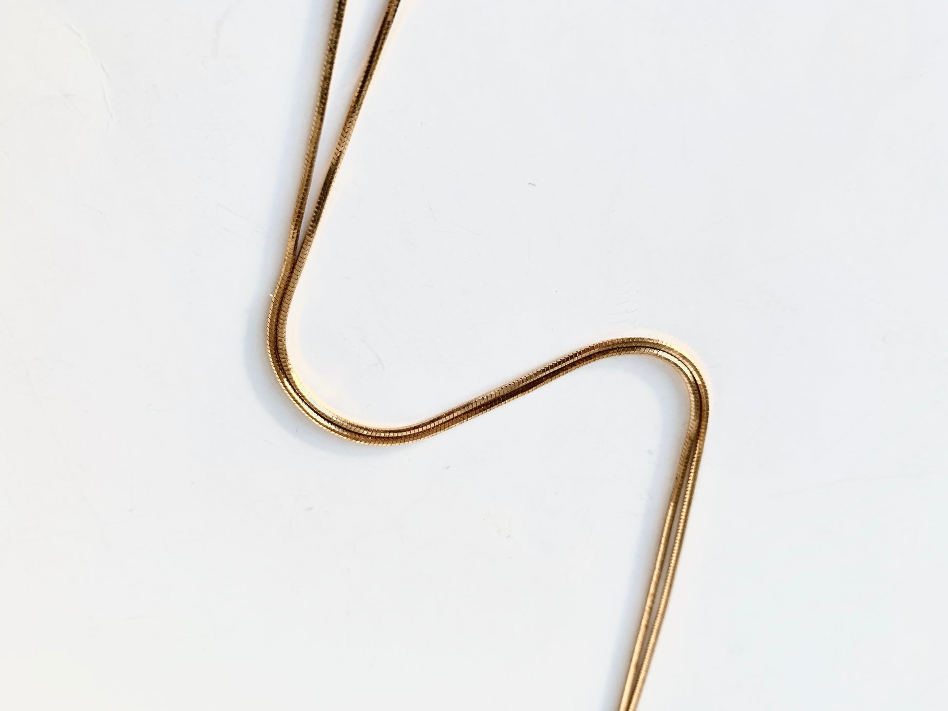 Shiny brass snake chain