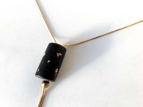 Gold foil in black clay pendant of adjustable bolo tie necklace