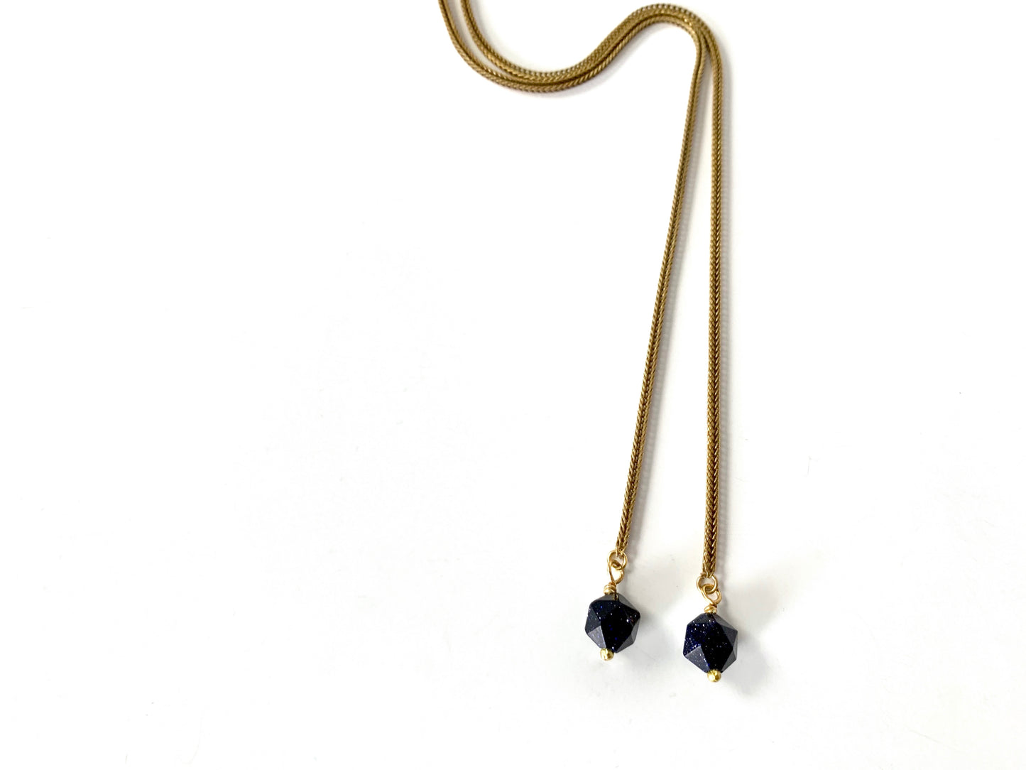 Foxtail chain and blue goldstone tips of the NOVA wrap necklace