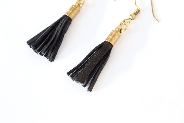 Close-up of recycled leather tassels of earrings