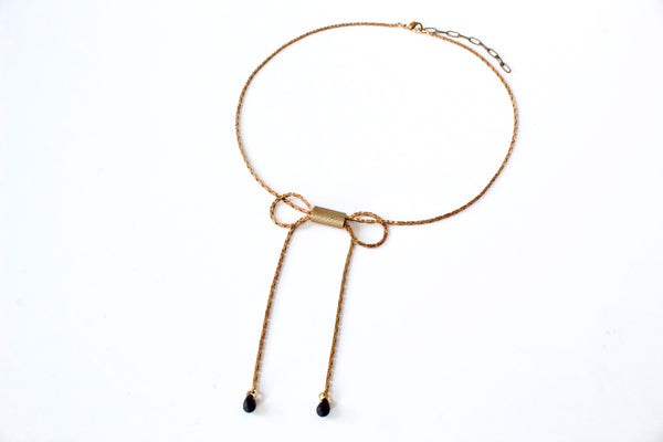 Gold bow choker necklace with black glass beads