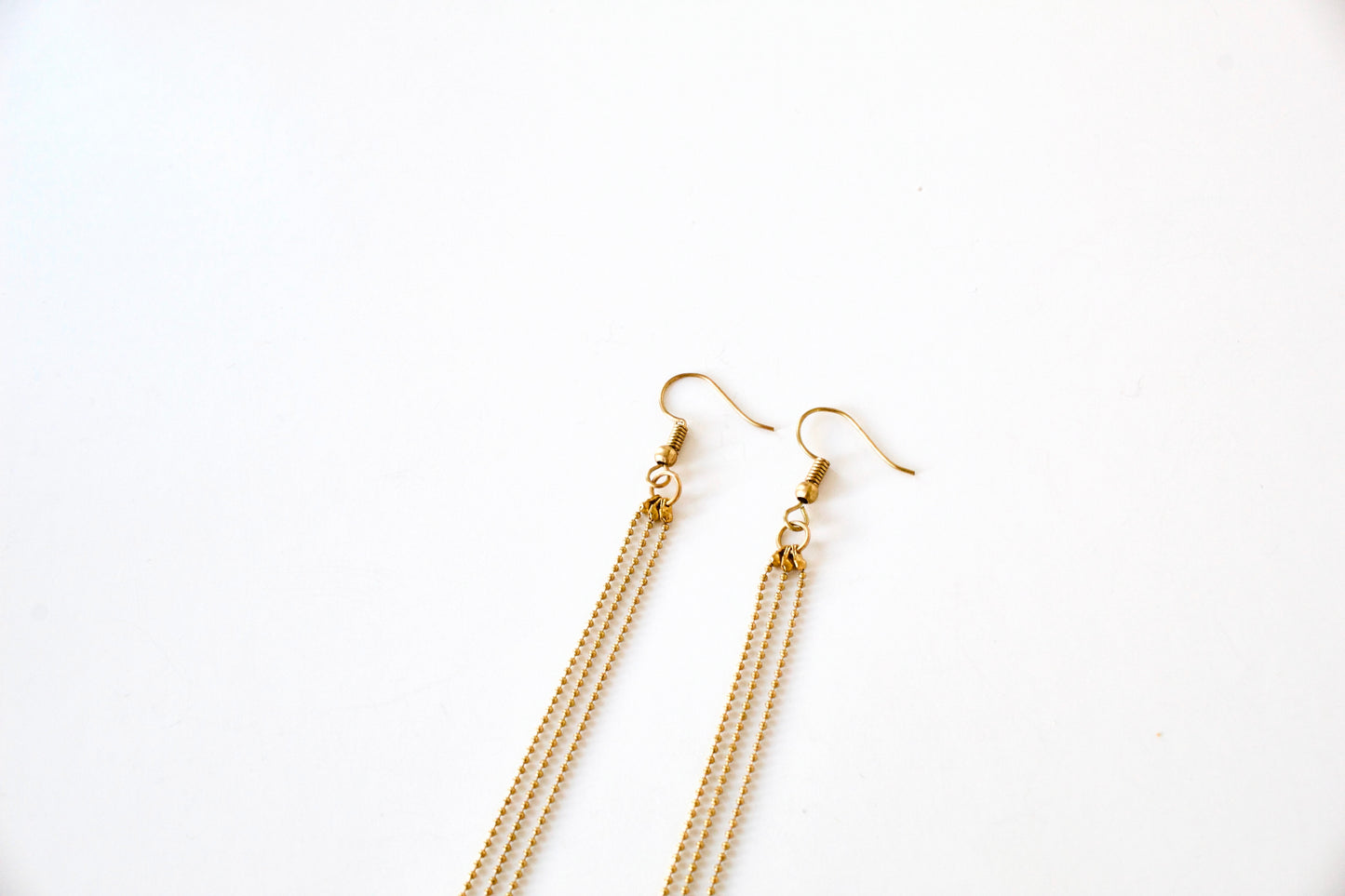 Earring hooks of gold tassel earrings