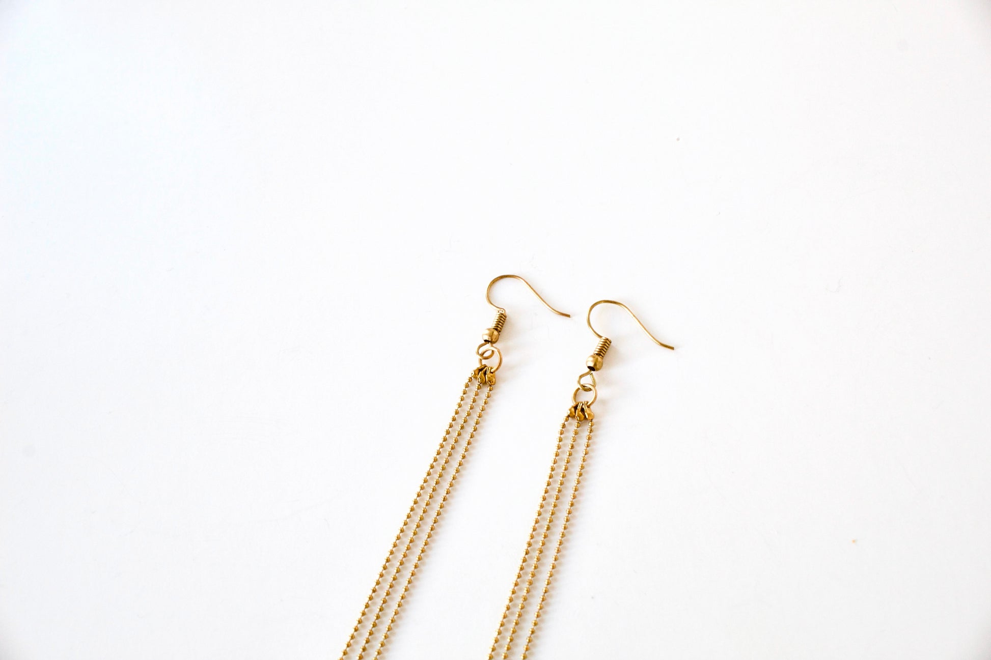 Earring hooks of gold tassel earrings