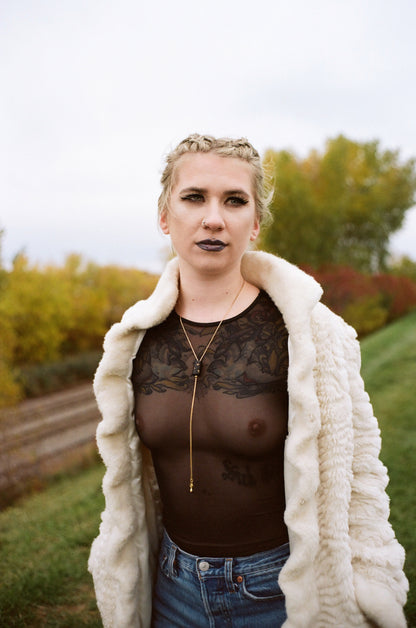 Model wearing holiday bolo tie necklace
