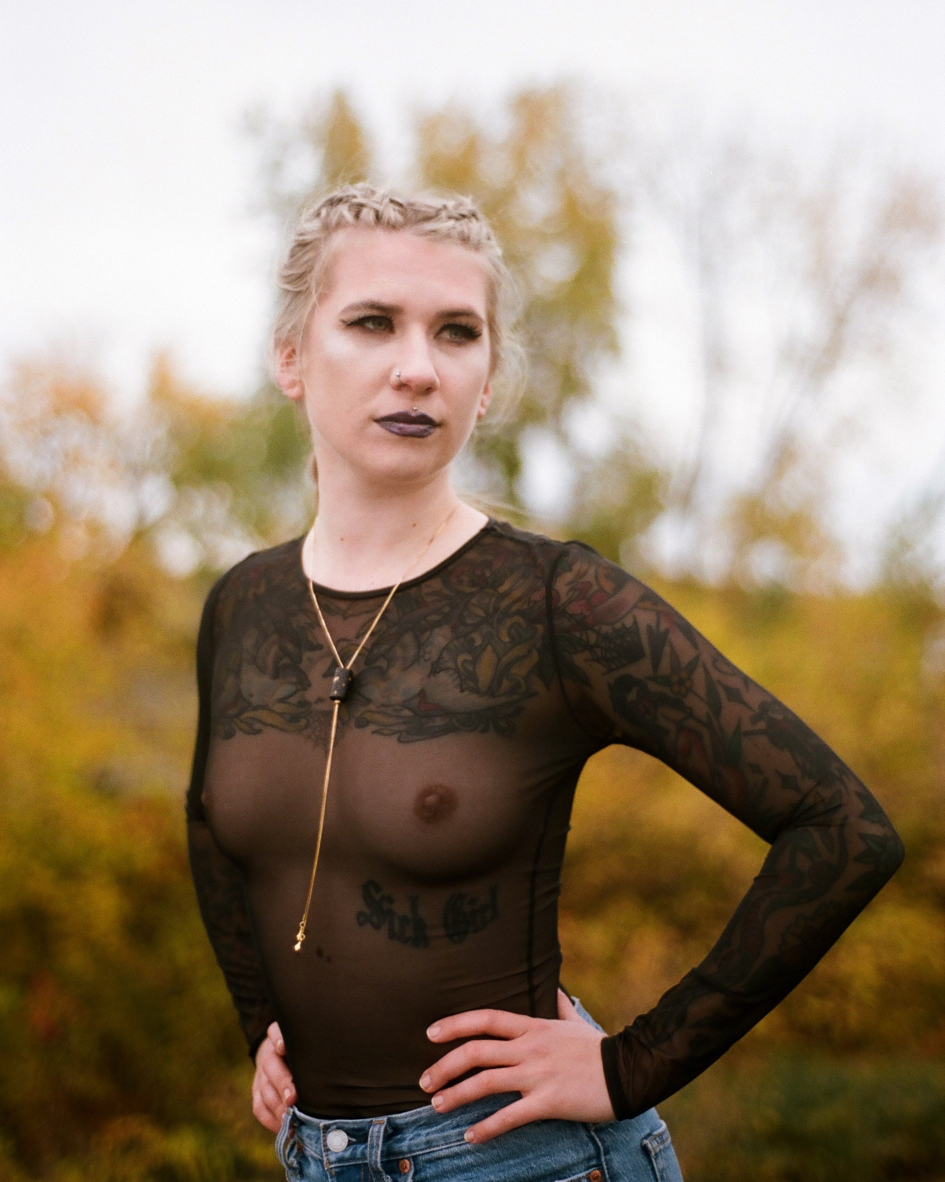 Side view of black gold bolo tie on model