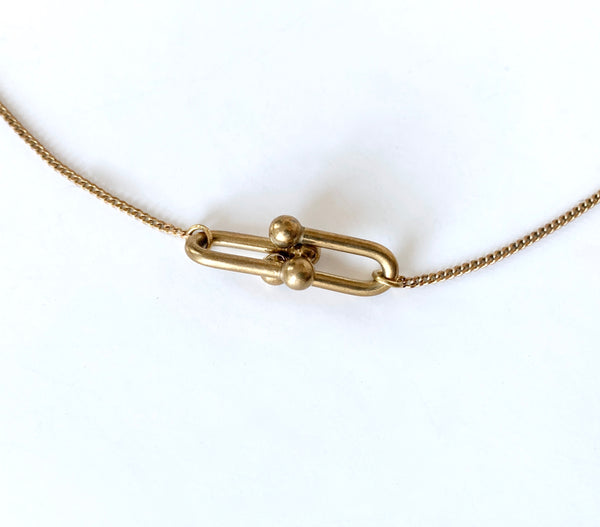 Chain links of pendant of delicate gold choker