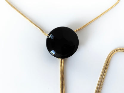 Close up of black onyx bolo tie pendant