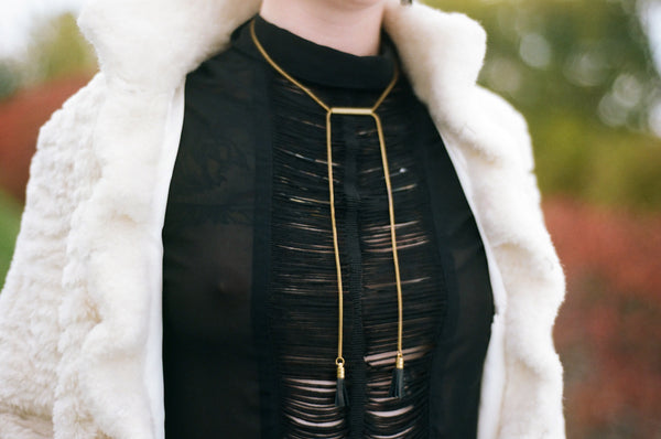 Close-up of tube necklace on a model