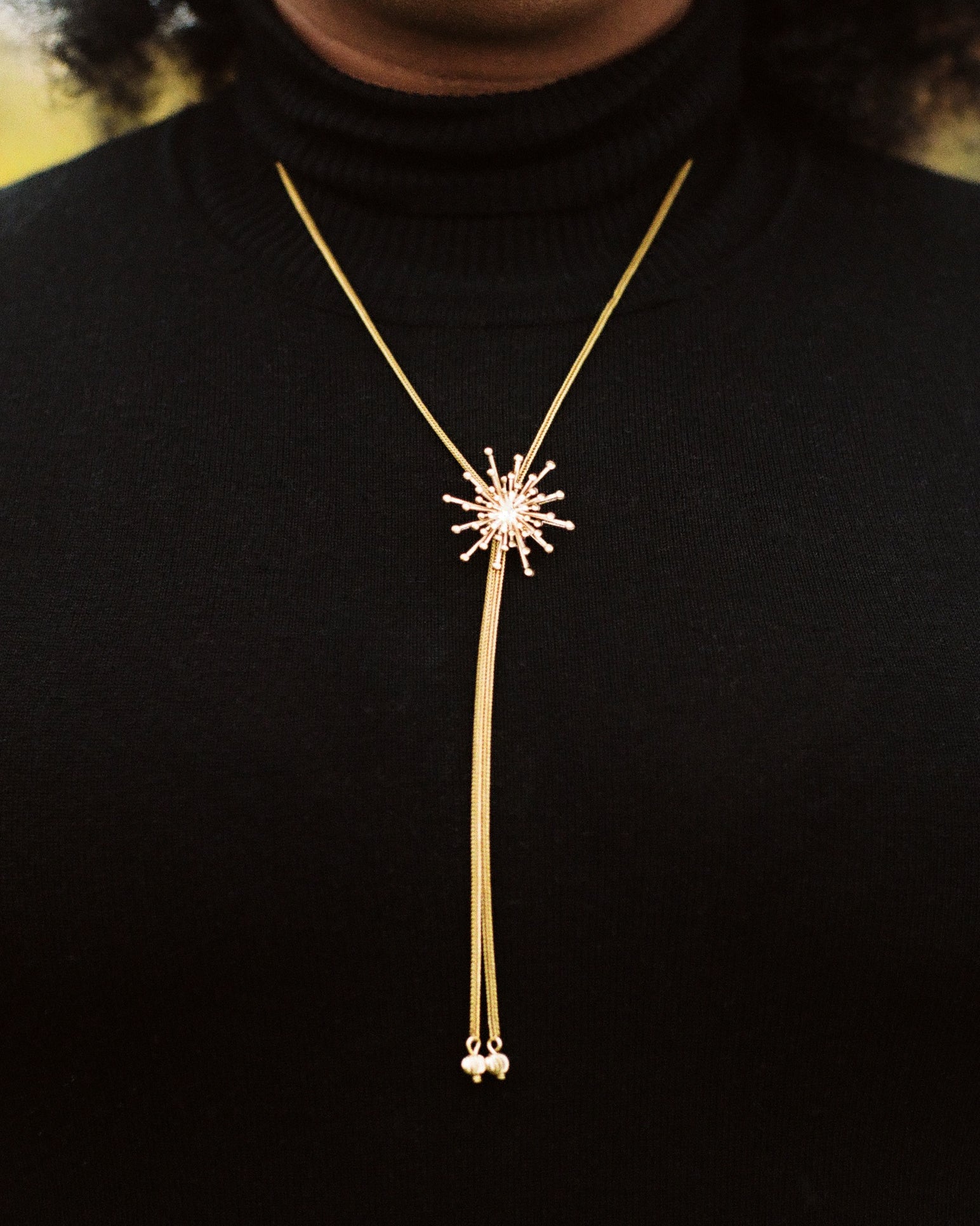 Close-up of star bolo tie necklace